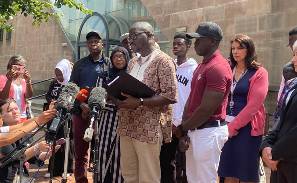 Aboubacarr Drammeh reads his statement outside court
