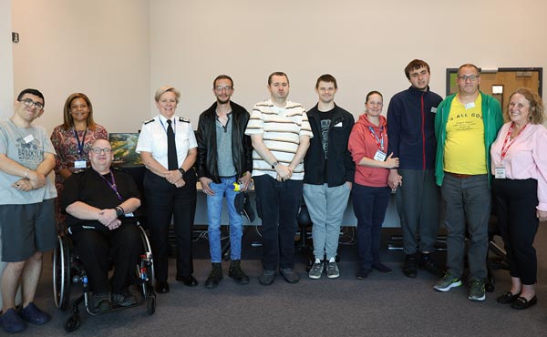 Lineup of people smiling for the camera.
