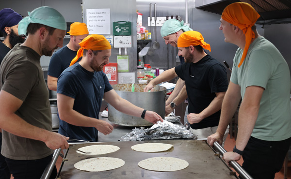 Off-duty police officers who cooked hot meals for vulnerable children as part of a charity initiative