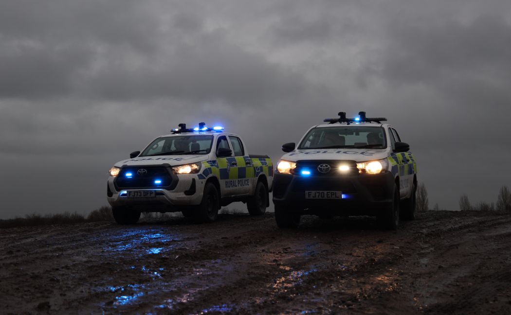 Two Toyota Hiluxes parked in remote area of Mansfield