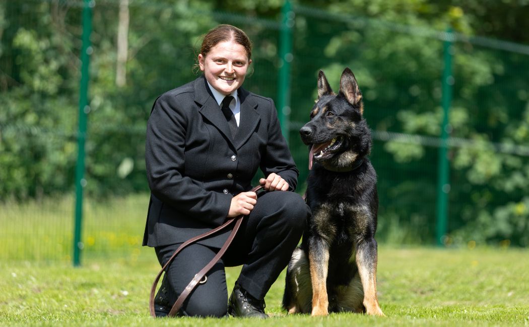 Police Constable Katie Brough posing with Police Dog Rooster