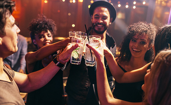 A group of people having drinks on a night out