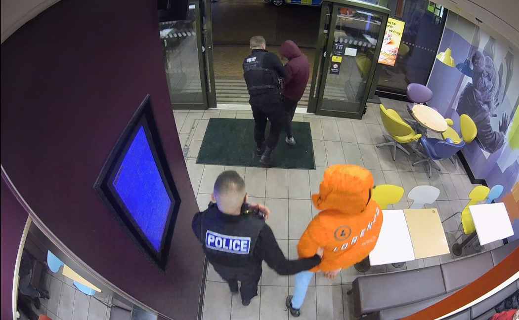 O'Neil and Morris are led away after their arrest