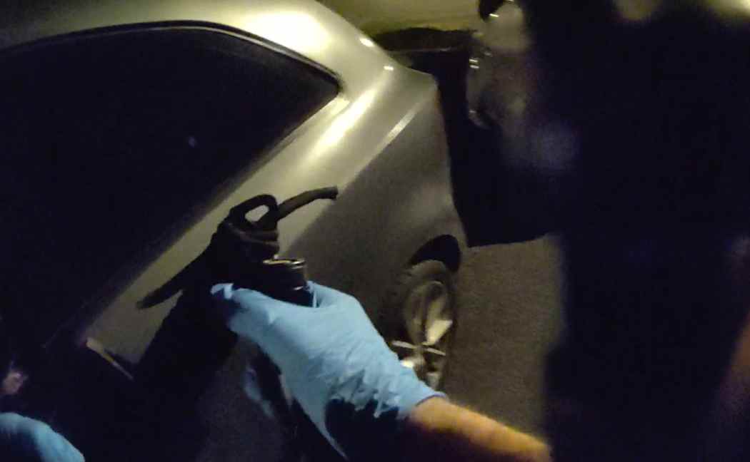 Officer holds a sheathed zombie knife