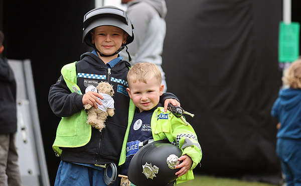 Two children wearing police uniform