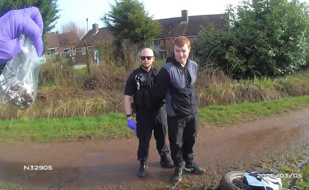 A bag of Class A drugs is held up in the foreground, while an officer arrests Corben Pearson in the background