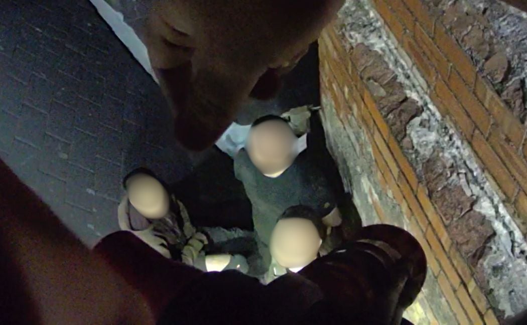 Three men were arrested on the roof of a building