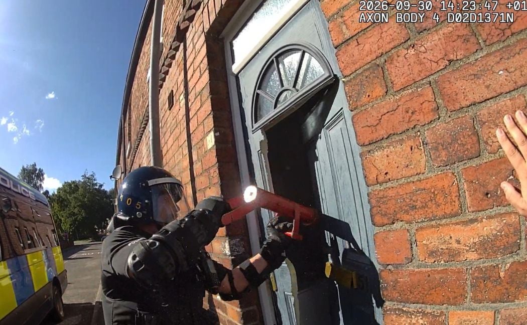 Officers force open one of the doors