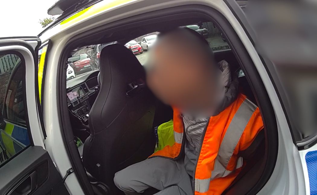 suspect in back of police car