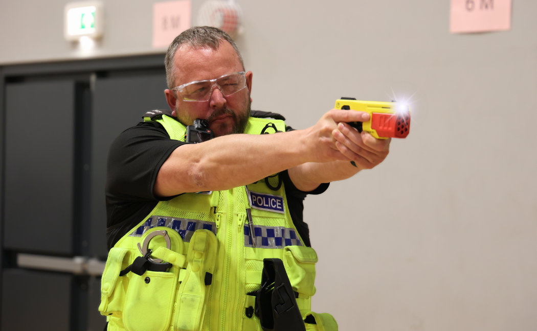 Officer with Taser